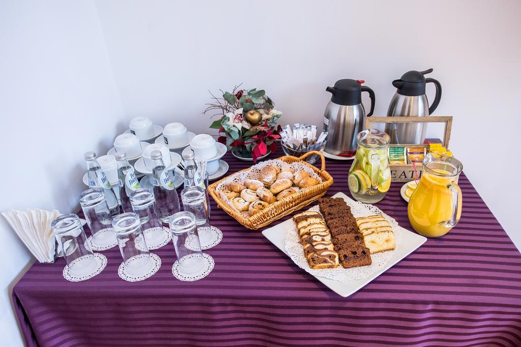Marshal Garden Hotel Bucharest Exterior photo A typical continental breakfast